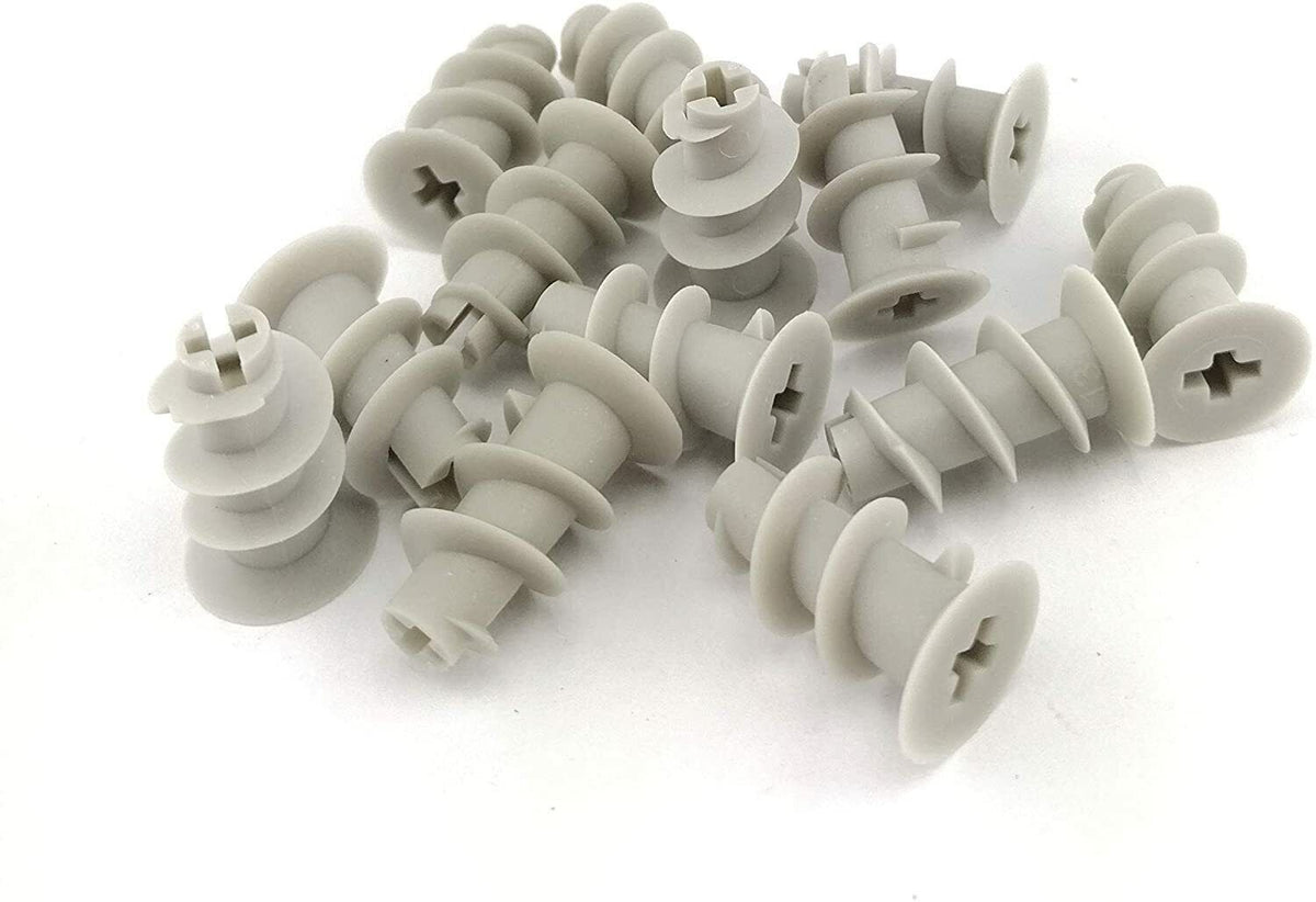 A pile of grey ABS plastic plasterboard wall plugs and drywall fixings with cross-recess countersunk heads and coarse external threads, on a white background