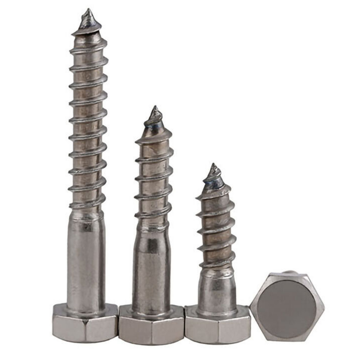 Three hex head coach screws standing on their heads and one lying beside them, on a white background