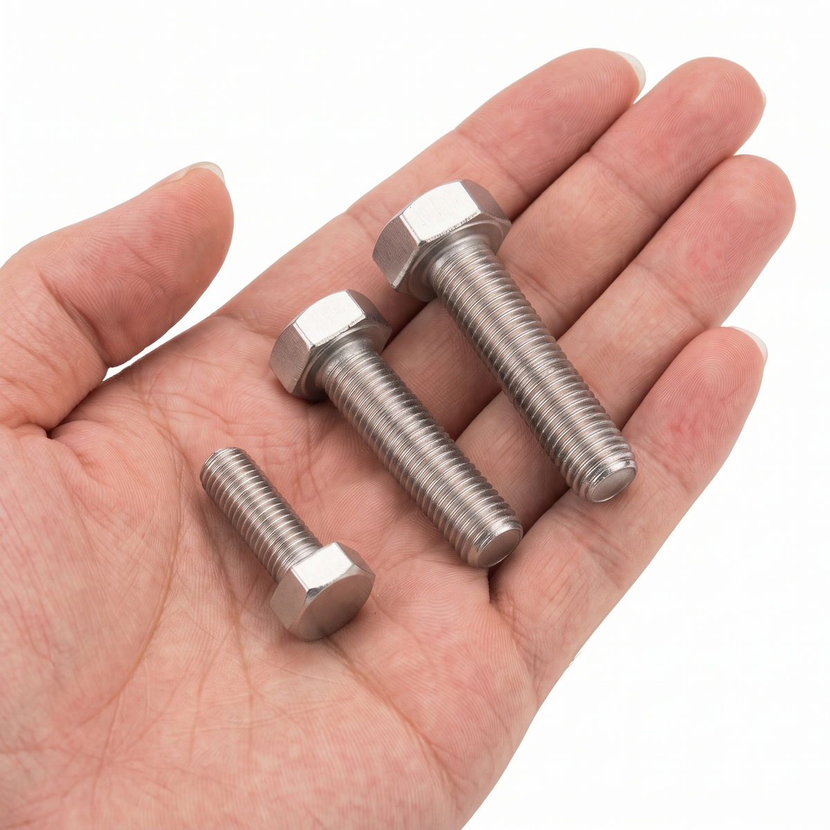 DIYUK A2 Stainless Steel Hexagon Head Bolts, DIN 933 / ISO 4017, three bolts of different sizes shown in hand for scale