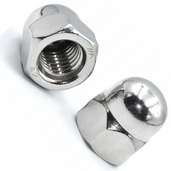 DIYUK A2 stainless steel dome nuts DIN 1587, two hex acorn cap nuts, one showing the internal thread and one the smooth rounded dome, on a white background