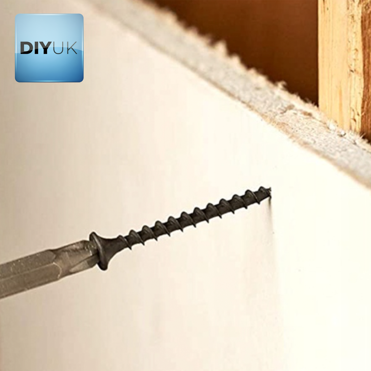 Black phosphate drywall screw fixing plasterboard to a timber stud