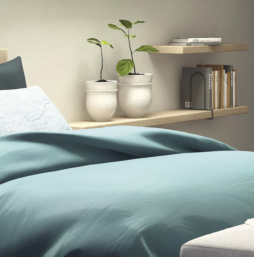 Sonoma oak floating shelves above a bed