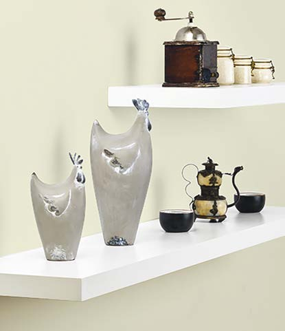 White gloss floating shelf styled with decor