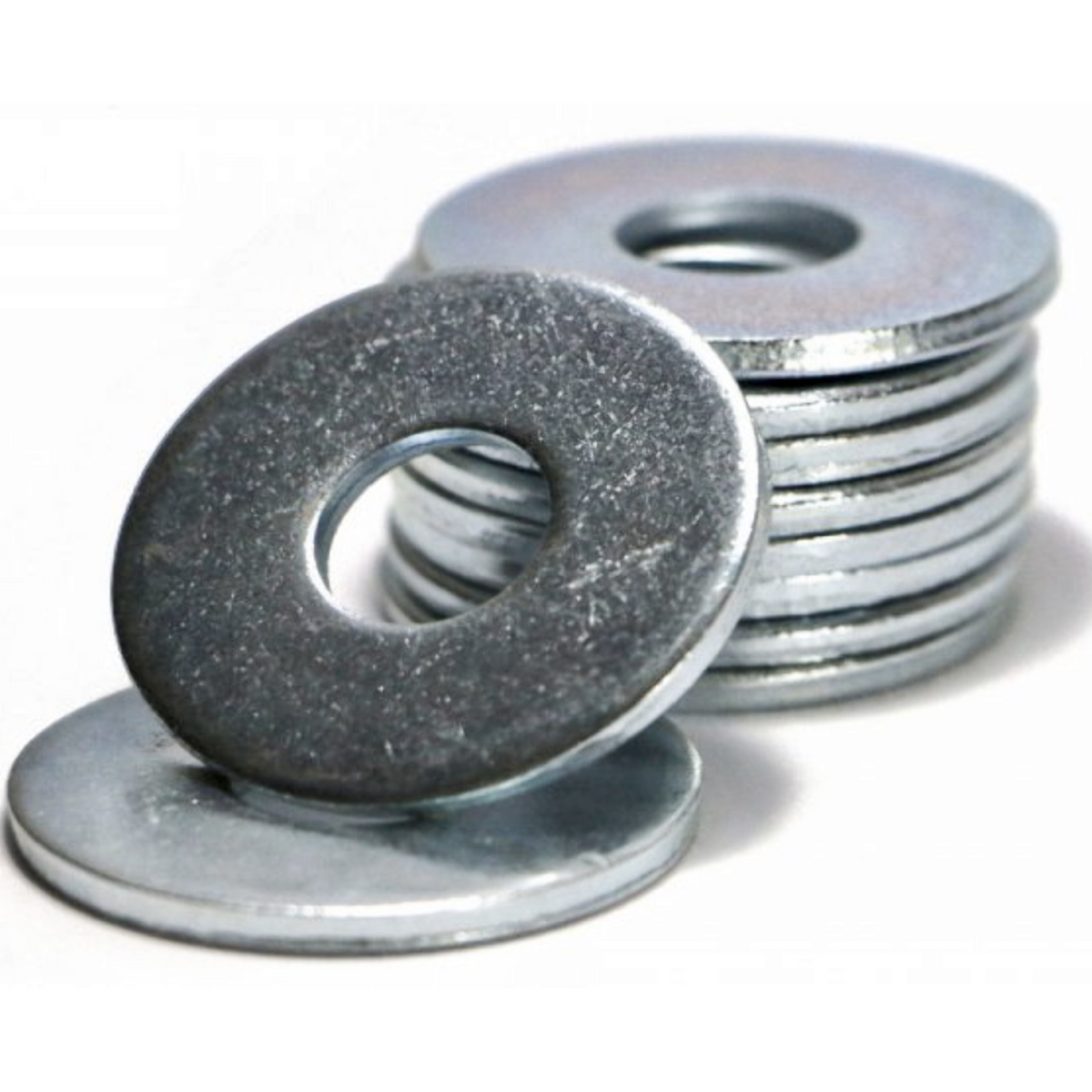 Stack of zinc-plated steel penny washers with one large washer in front, on a white background