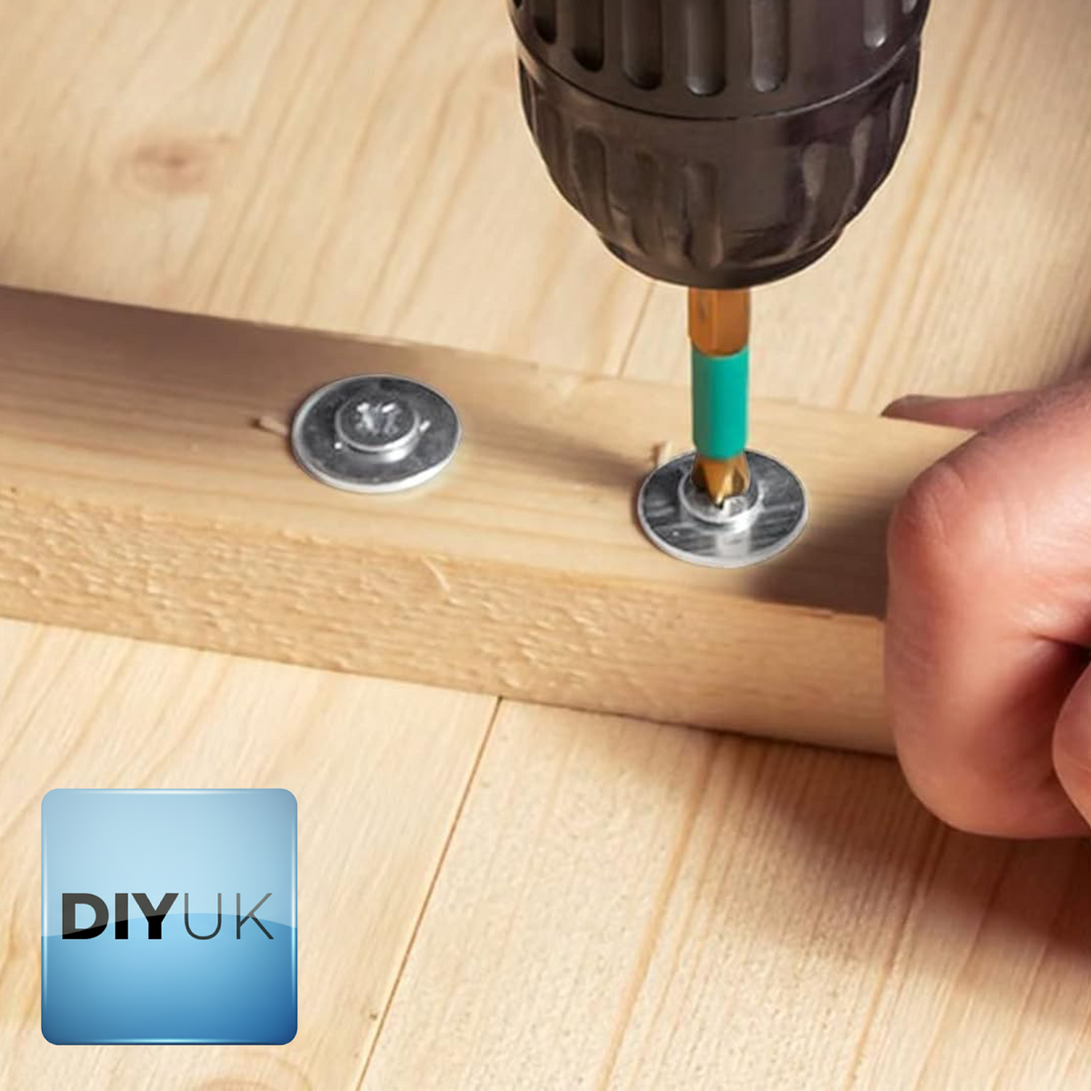 Screws driven through penny washers into a timber batten with a drill