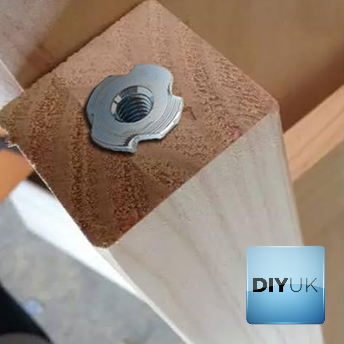 Zinc plated T-nut fitted flush in the end of a timber leg