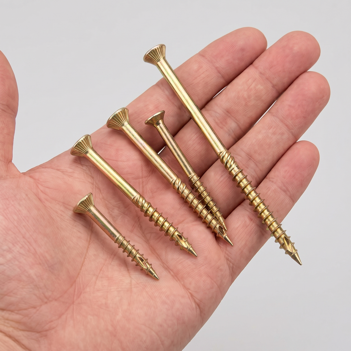 DIYUK Yellow Torx Countersunk Wood Screws, Zinc-Plated Steel, shown in hand for scale