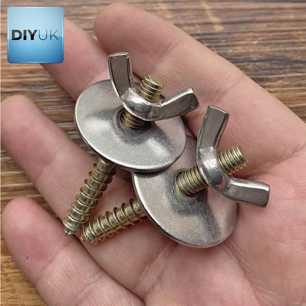 Two wing nuts with washers on threaded screws, shown in hand